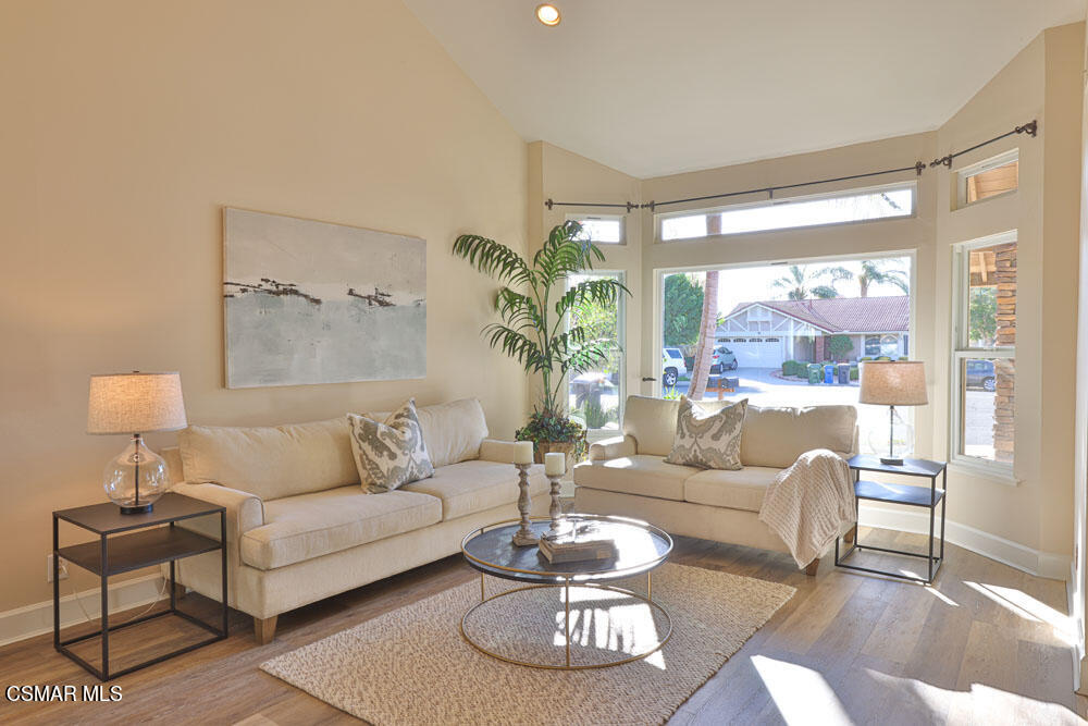 13520 Bear Valley Road Moorpark, CA 93021 - Photo 11 of 53 a living room with furniture and a large window