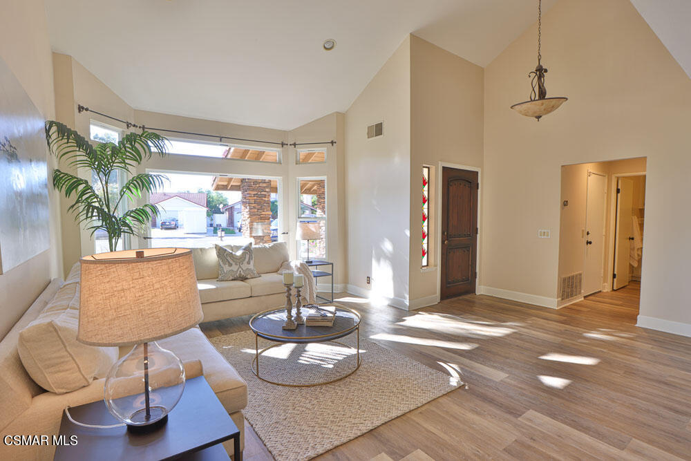 13520 Bear Valley Road Moorpark, CA 93021 - Photo 15 of 53 a living room with furniture and a wooden floor