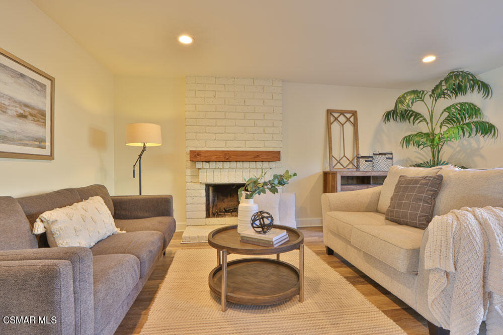 13520 Bear Valley Road Moorpark, CA 93021 - Photo 17 of 53 a living room with furniture and a fireplace