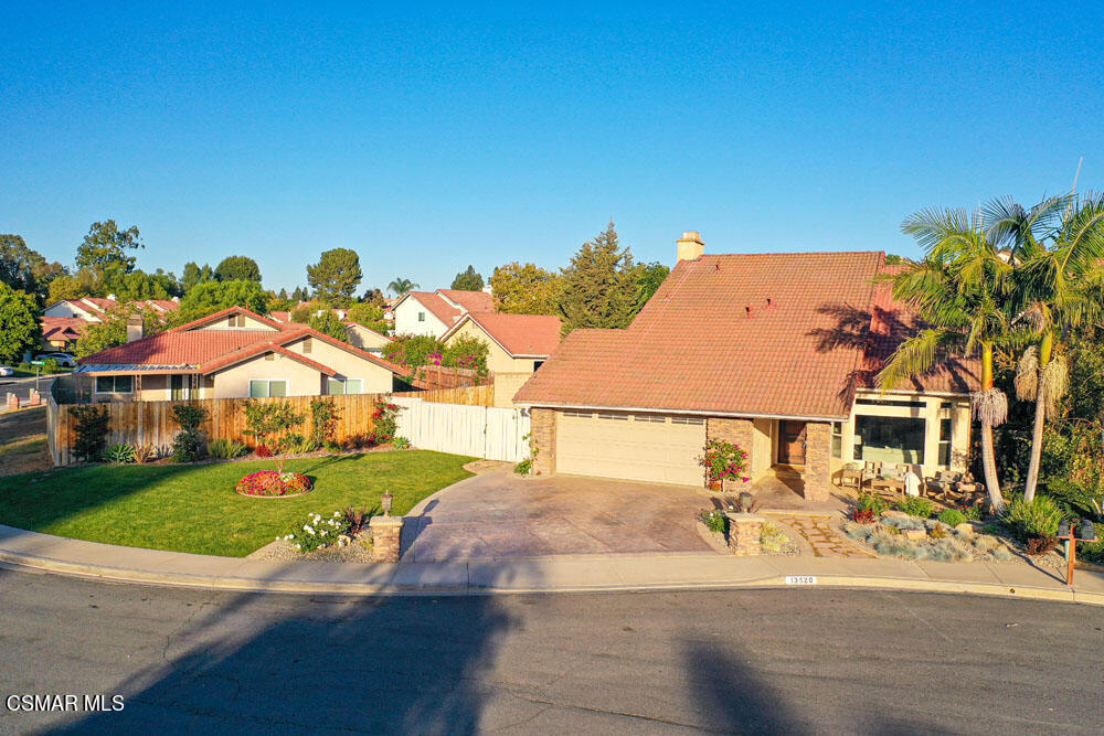 13520 Bear Valley Road Moorpark, CA 93021 - Photo 3 of 53 a view of a white house with a yard