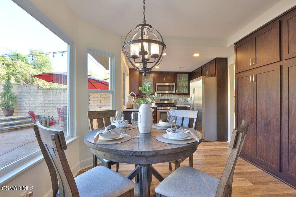 13520 Bear Valley Road Moorpark, CA 93021 - Photo 22 of 53 a view of a dining room with furniture window and outside view