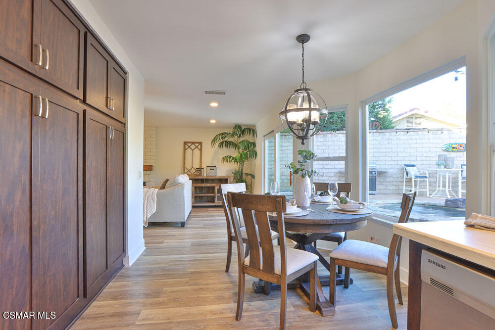 13520 Bear Valley Road Moorpark, CA 93021 - Photo 23 of 53 a dining room with furniture window wooden floor