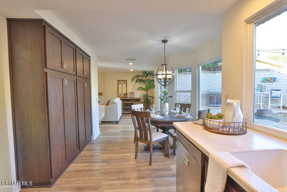 13520 Bear Valley Road Moorpark, CA 93021 - Photo 28 of 53 a view of a dining room with furniture window and wooden floor