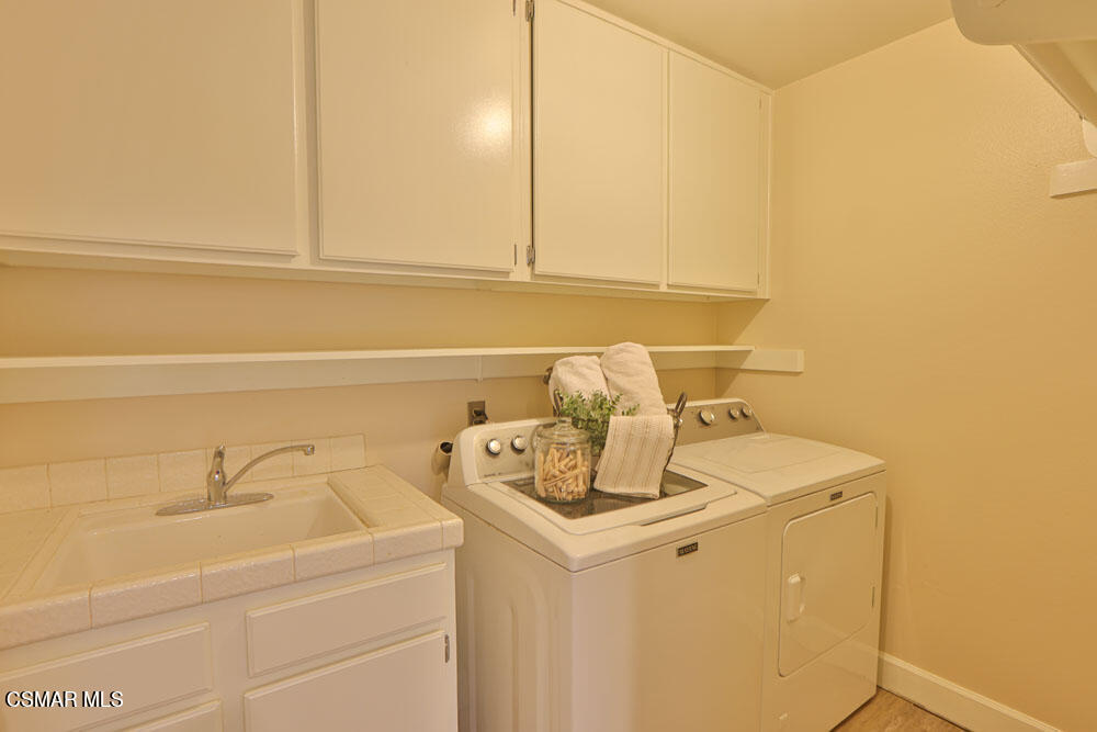13520 Bear Valley Road Moorpark, CA 93021 - Photo 30 of 53 a utility room with dryer and washer