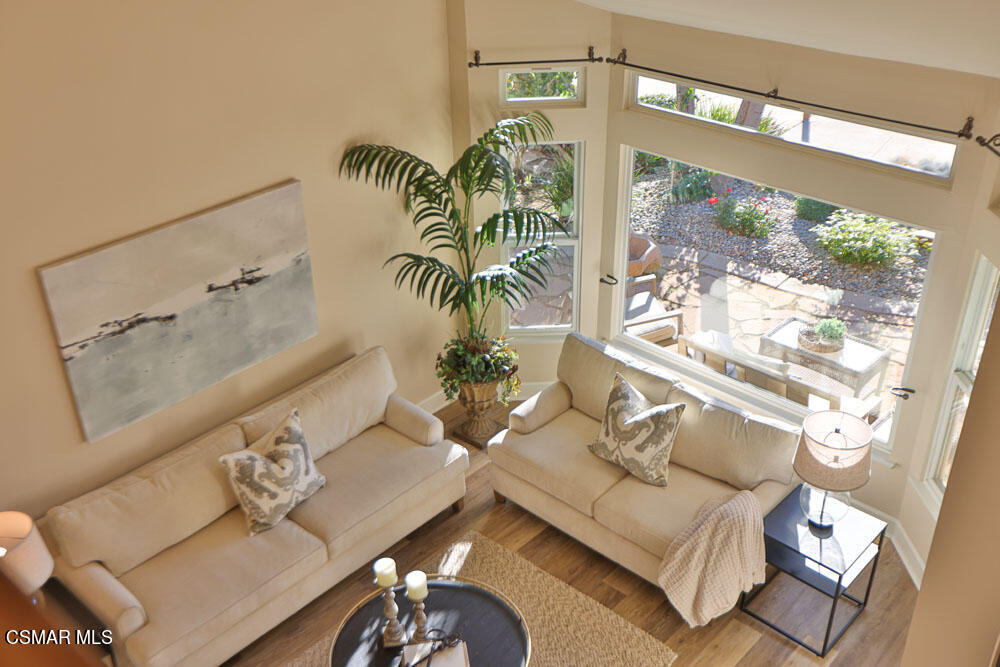 13520 Bear Valley Road Moorpark, CA 93021 - Photo 32 of 53 a living room with furniture and a floor to ceiling window