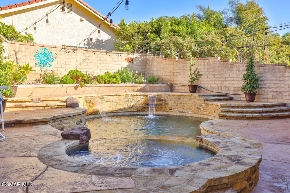 13520 Bear Valley Road Moorpark, CA 93021 - Photo 33 of 53 a view of a swimming pool with a patio