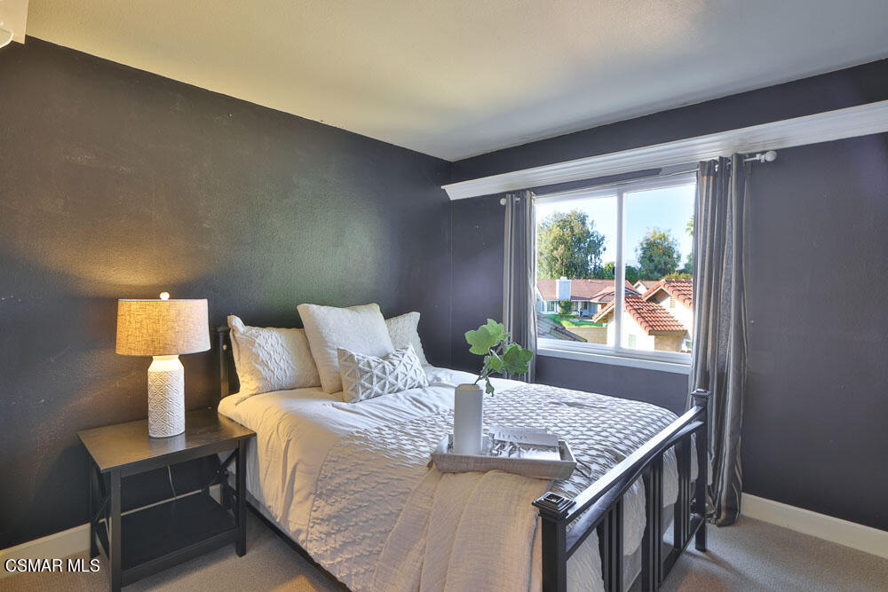 13520 Bear Valley Road Moorpark, CA 93021 - Photo 34 of 53 a bed sitting in a bedroom next to a window