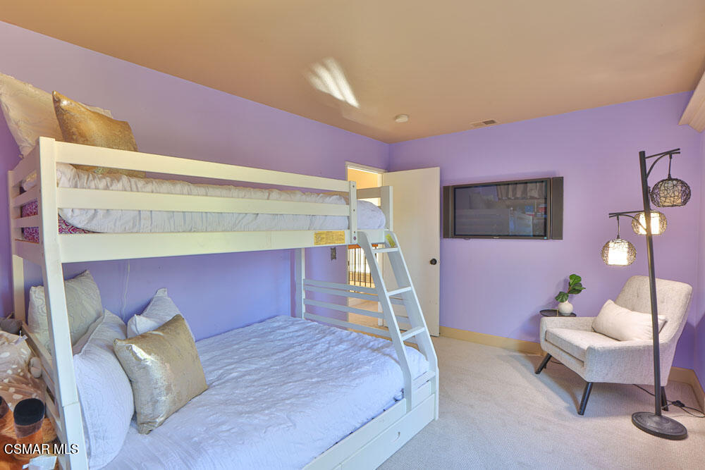 13520 Bear Valley Road Moorpark, CA 93021 - Photo 39 of 53 a bed room with a bed and a chair