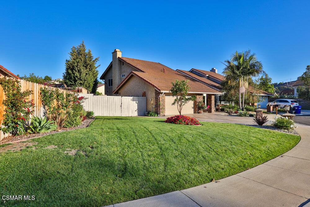 13520 Bear Valley Road Moorpark, CA 93021 - Photo 5 of 53 a front view of a house with garden