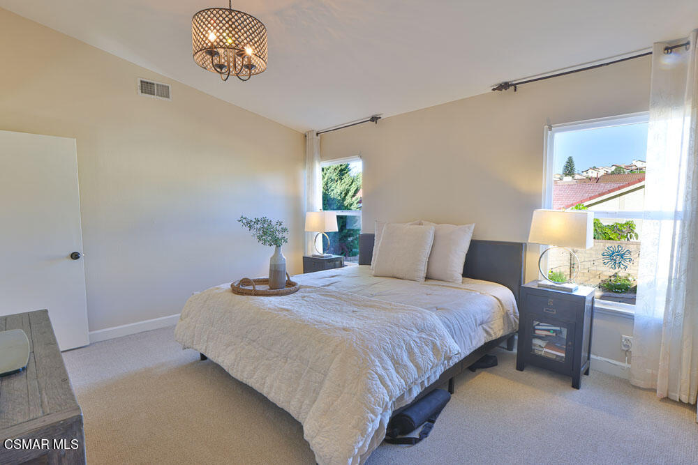 13520 Bear Valley Road Moorpark, CA 93021 - Photo 41 of 53 a bedroom with a bed and a table