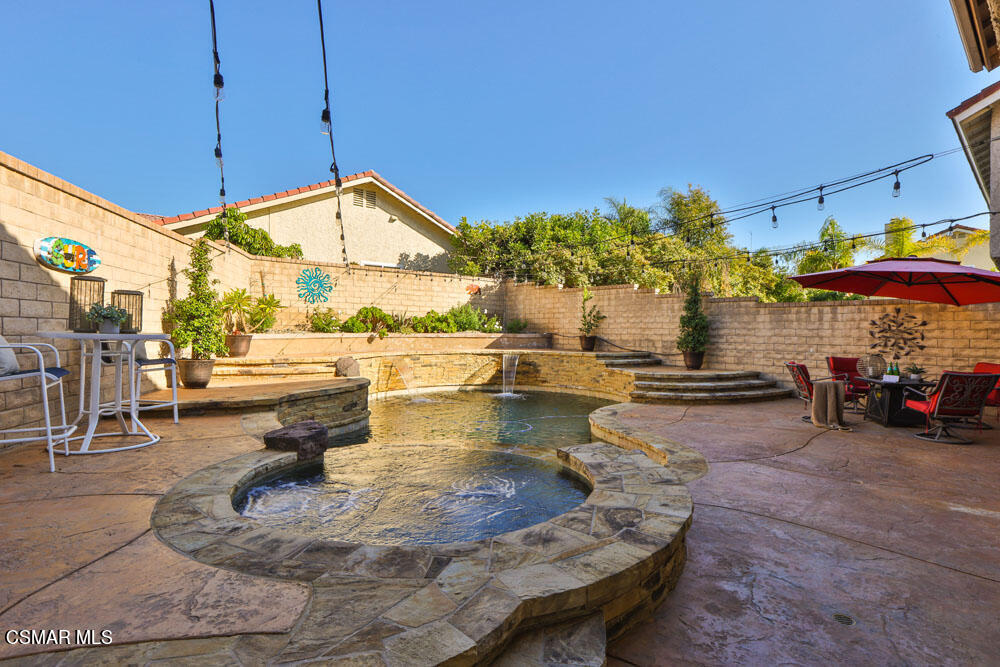 13520 Bear Valley Road Moorpark, CA 93021 - Photo 45 of 53 a view of a swimming pool with a lounge chairs