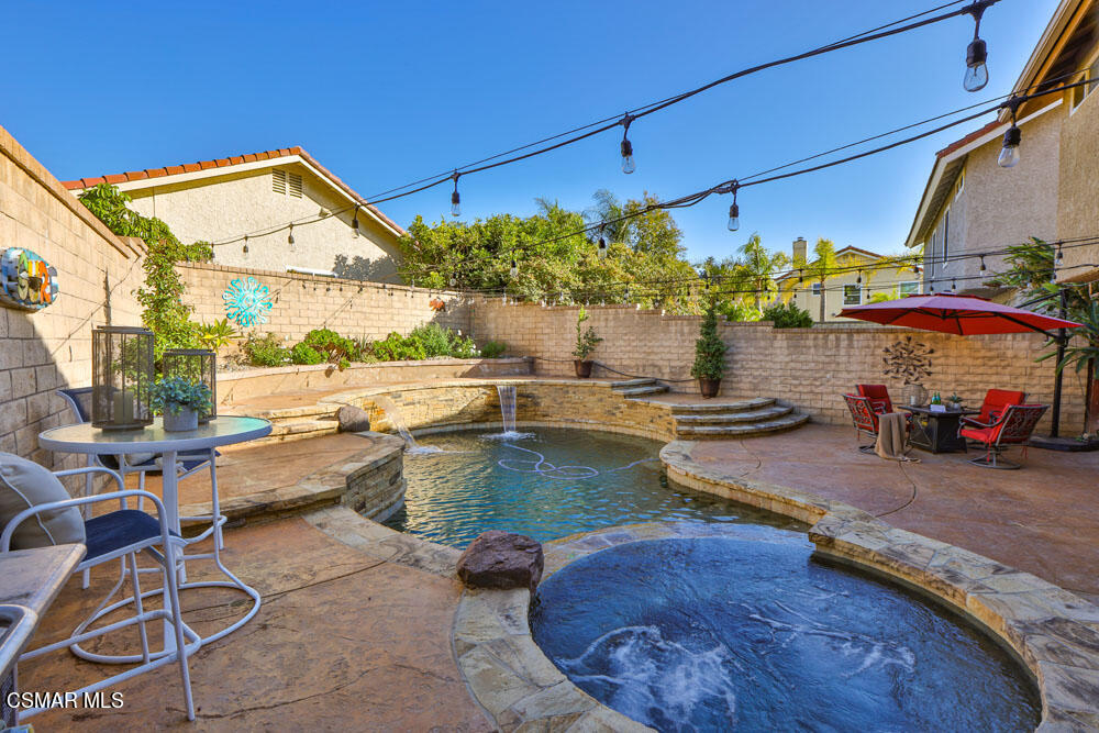13520 Bear Valley Road Moorpark, CA 93021 - Photo 46 of 53 a view of a patio with table and chairs potted plants