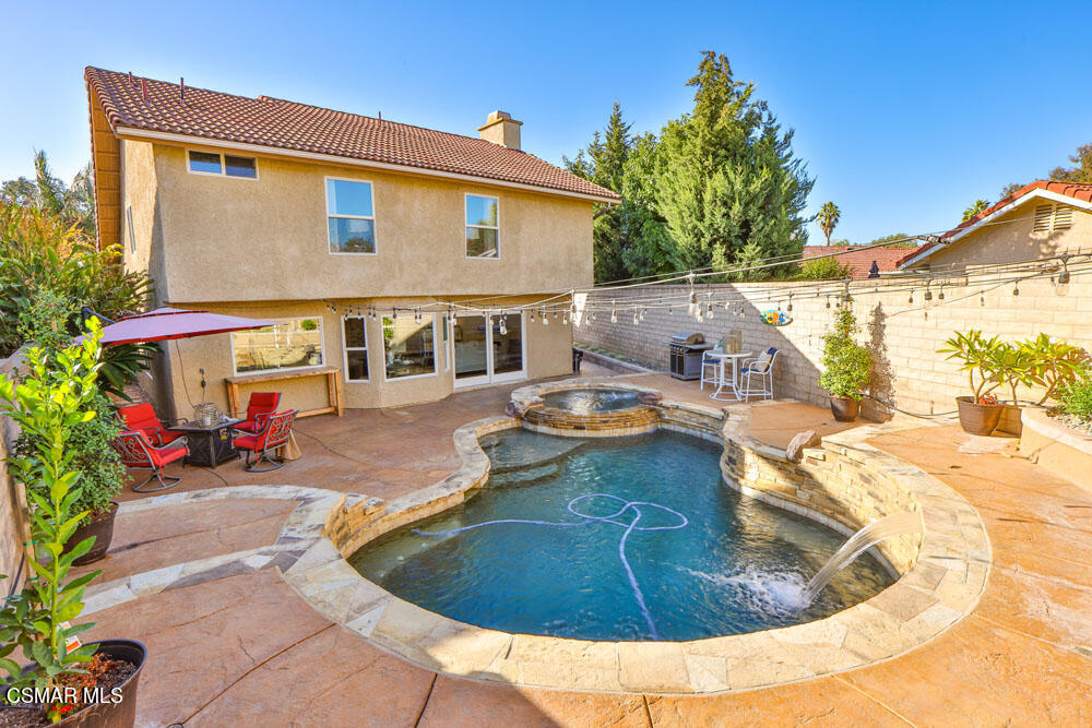13520 Bear Valley Road Moorpark, CA 93021 - Photo 50 of 53 a view of a house with backyard and sitting area