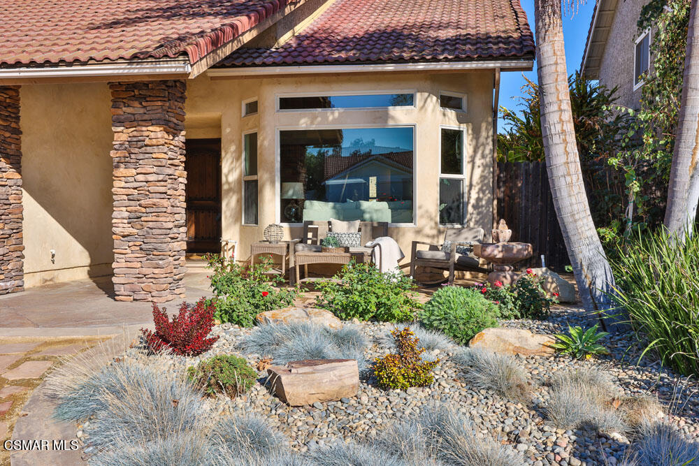 13520 Bear Valley Road Moorpark, CA 93021 - Photo 6 of 53 a front view of a house with garden