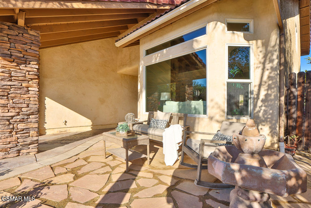 13520 Bear Valley Road Moorpark, CA 93021 - Photo 8 of 53 a view of a patio with table and chairs and potted plants