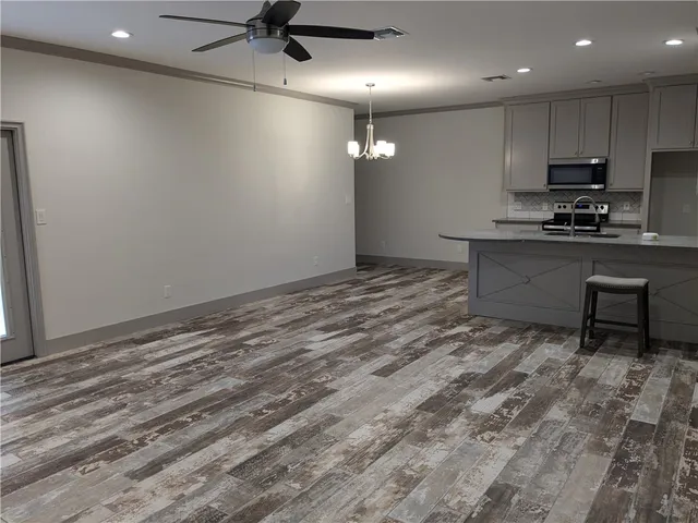 a view of kitchen with microwave and stove
