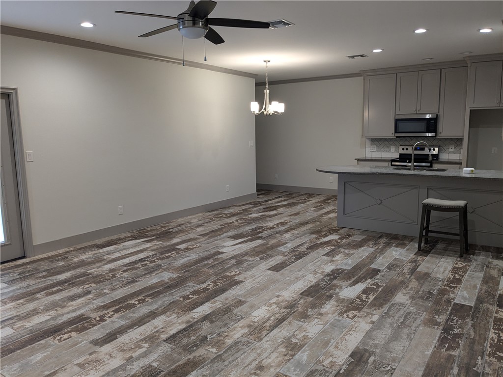 5375 County Road 73A, Unit D75 Robstown, TX 78380 - Photo 3 of 14 a view of kitchen with microwave and stove