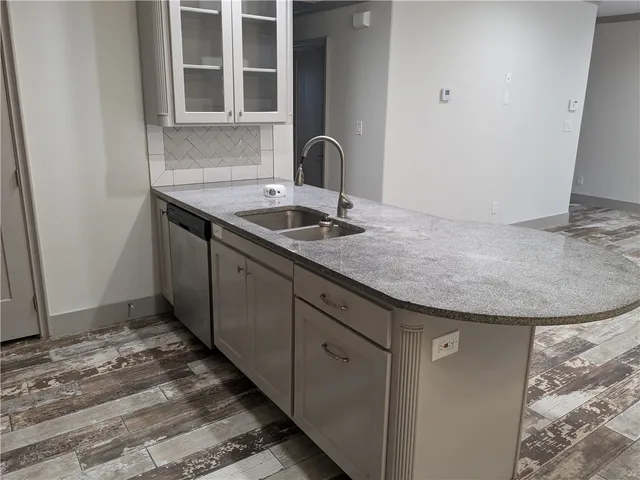 a kitchen with a sink and a stove