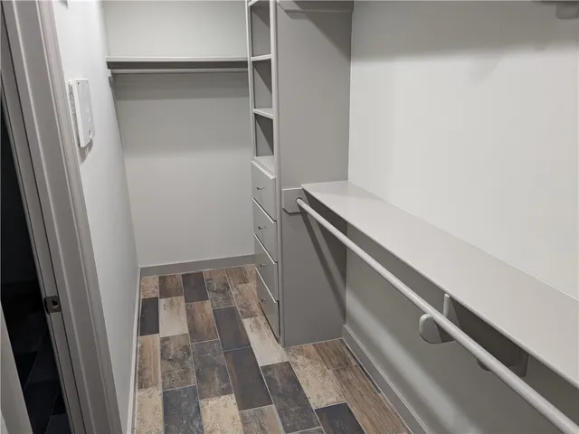 a bathroom with a sink and glass door