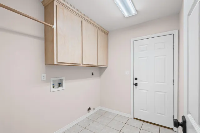 a view of a livingroom with wooden floor and a large window