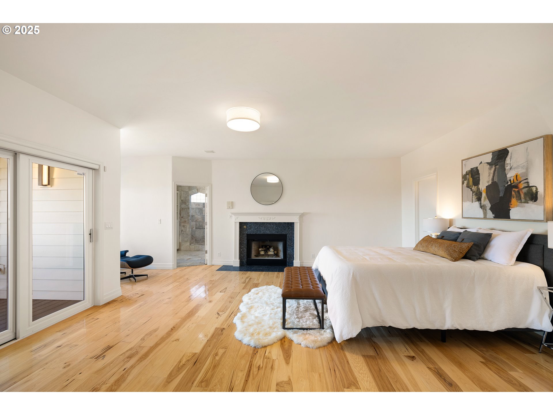 2647 West 29th Avenue Eugene, OR 97405 - Photo 26 of 48 a bedroom with a bed and a fireplace