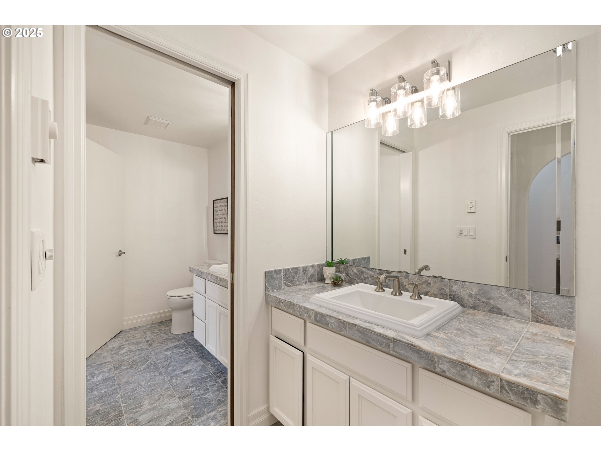 2647 West 29th Avenue Eugene, OR 97405 - Photo 35 of 48 a bathroom with a sink vanity granite and a toilet