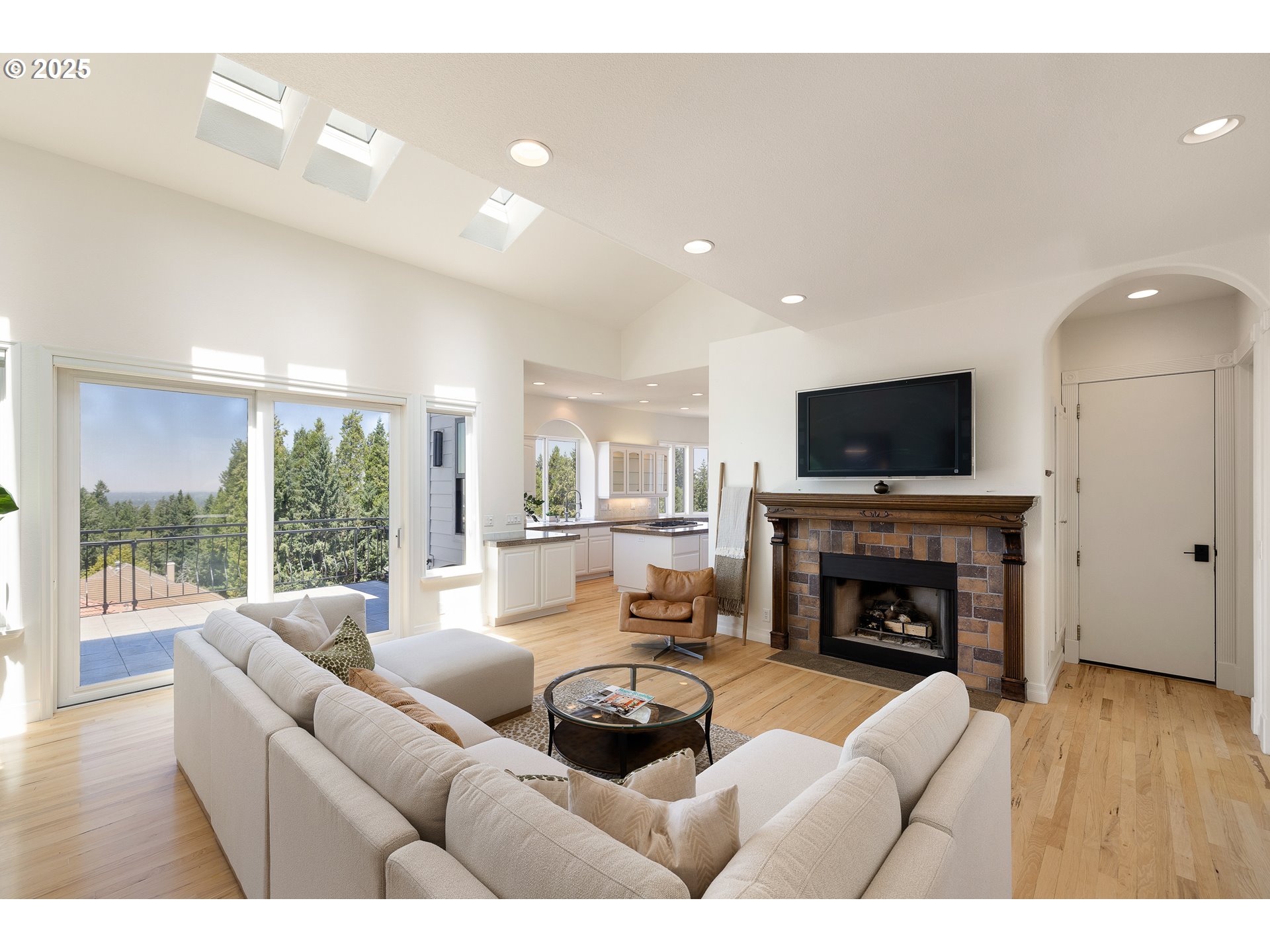 2647 West 29th Avenue Eugene, OR 97405 - Photo 6 of 48 a living room with furniture a fireplace and a flat screen tv