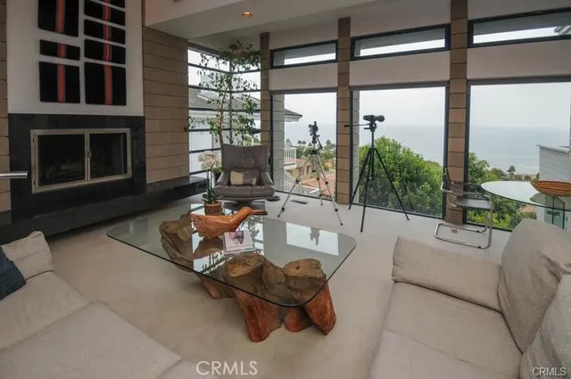 a living room with furniture fireplace and flat screen tv