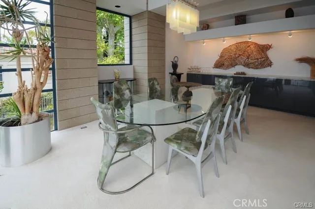 a dining room with furniture and window