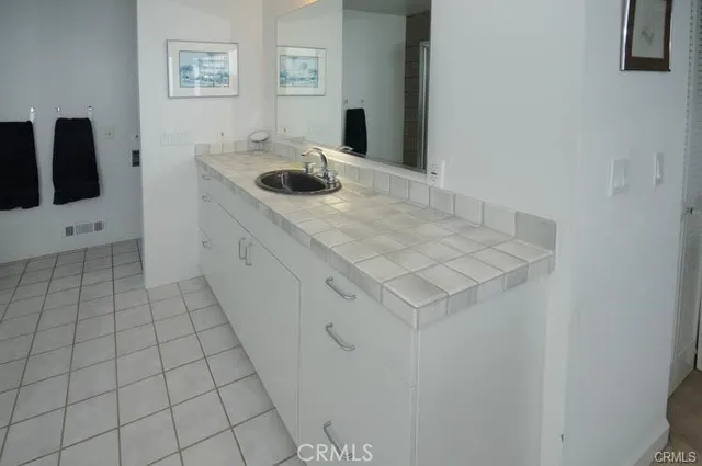 a bathroom with a sink and vanity