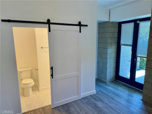 a view of bathroom with a shower and a toilet