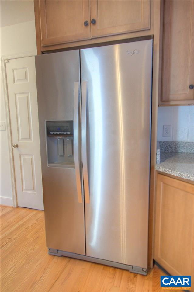 4865 Mechums River Road Charlottesville, VA 22901 - Photo 12 of 45 a view of a refrigerator in kitchen with stainless steel appliances granite countertop cabinets and a refrigerator