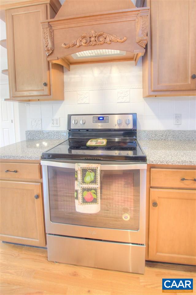 4865 Mechums River Road Charlottesville, VA 22901 - Photo 13 of 45 a stove top oven sitting inside of a kitchen