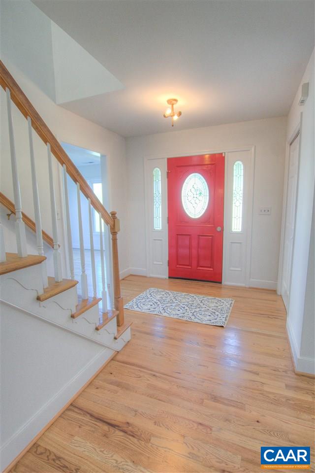 4865 Mechums River Road Charlottesville, VA 22901 - Photo 15 of 45 a view of an empty room with wooden floor