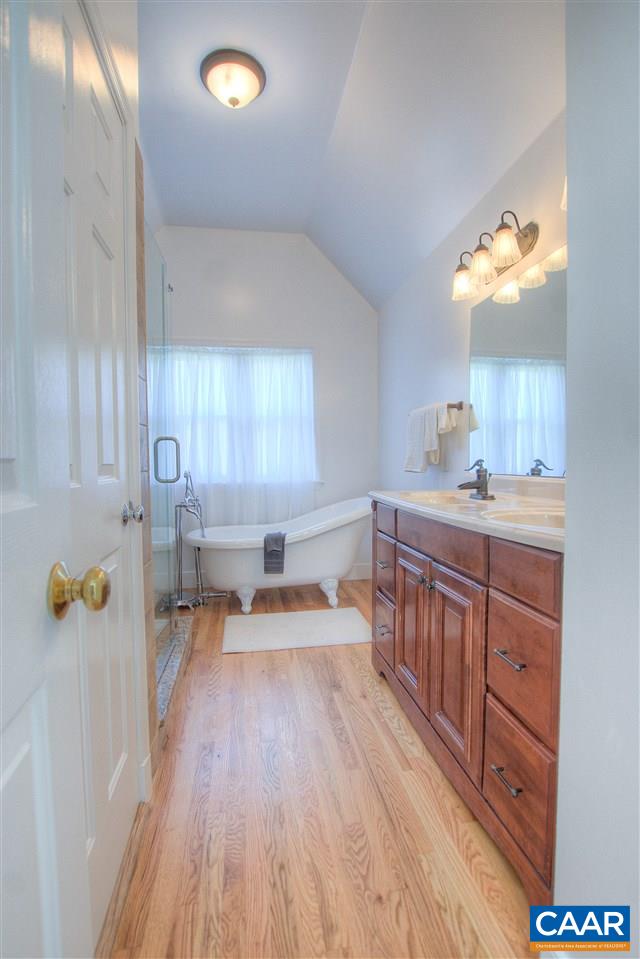 4865 Mechums River Road Charlottesville, VA 22901 - Photo 27 of 45 a kitchen with sink cabinets and wooden floor