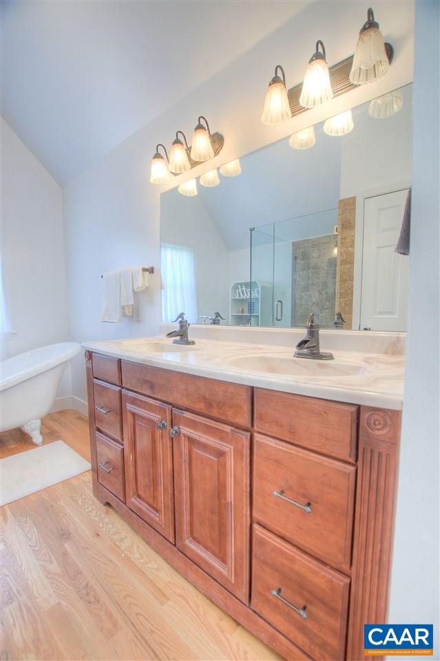 4865 Mechums River Road Charlottesville, VA 22901 - Photo 28 of 45 a bathroom with a sink vanity and a mirror