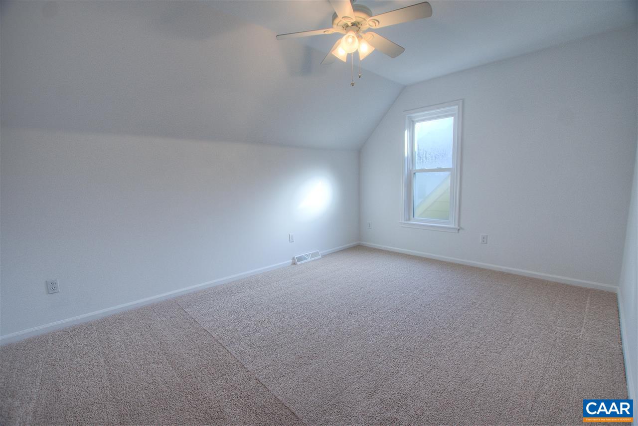 4865 Mechums River Road Charlottesville, VA 22901 - Photo 31 of 45 an empty room with windows and fan