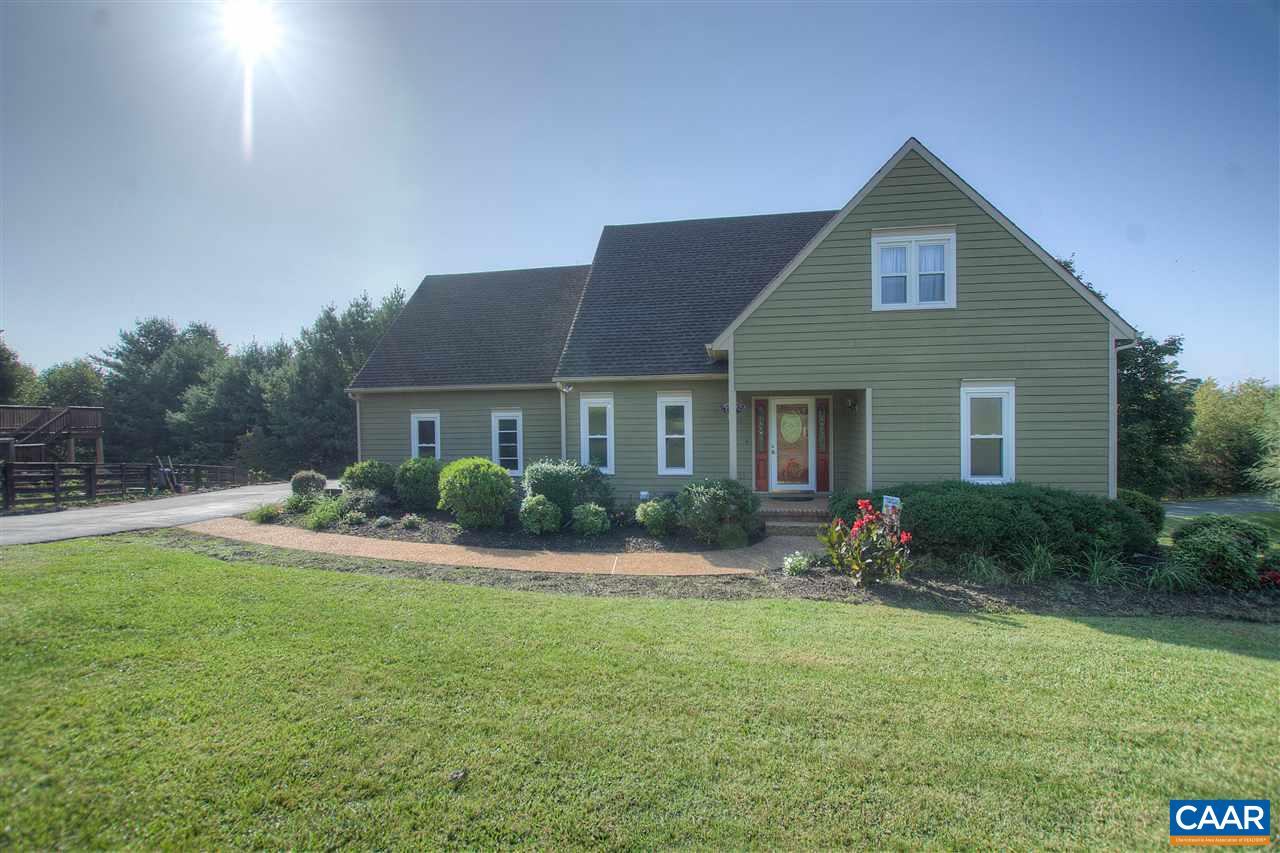 4865 Mechums River Road Charlottesville, VA 22901 - Photo 4 of 45 a front view of a house with yard and green space