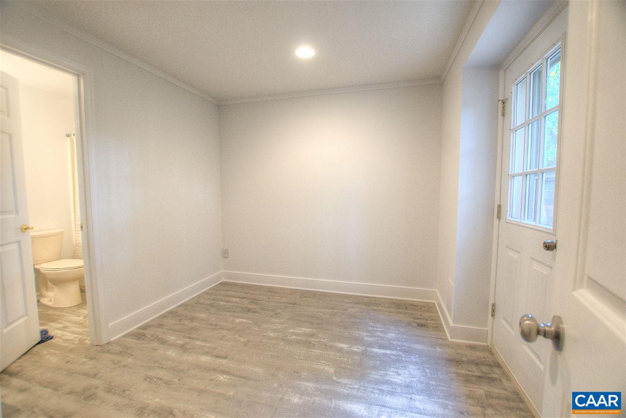 4865 Mechums River Road Charlottesville, VA 22901 - Photo 44 of 45 wooden floor in an empty room with a window