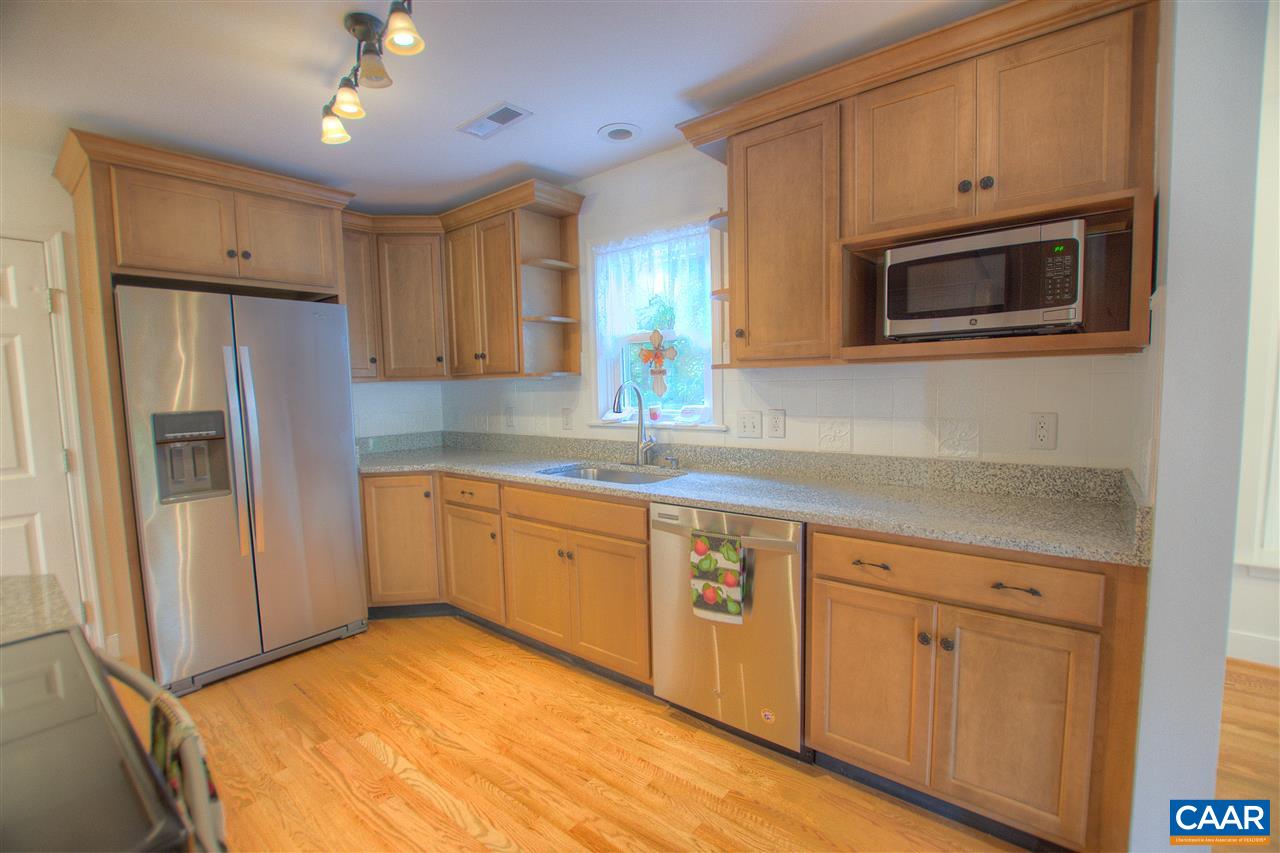 4865 Mechums River Road Charlottesville, VA 22901 - Photo 10 of 45 a kitchen with granite countertop a refrigerator sink and cabinets