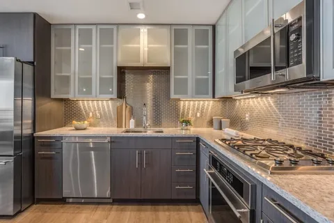 a kitchen with a stove and a microwave