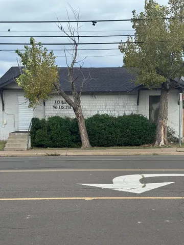 a view of a house with a street
