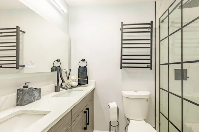 a bathroom with a sink toilet and shower