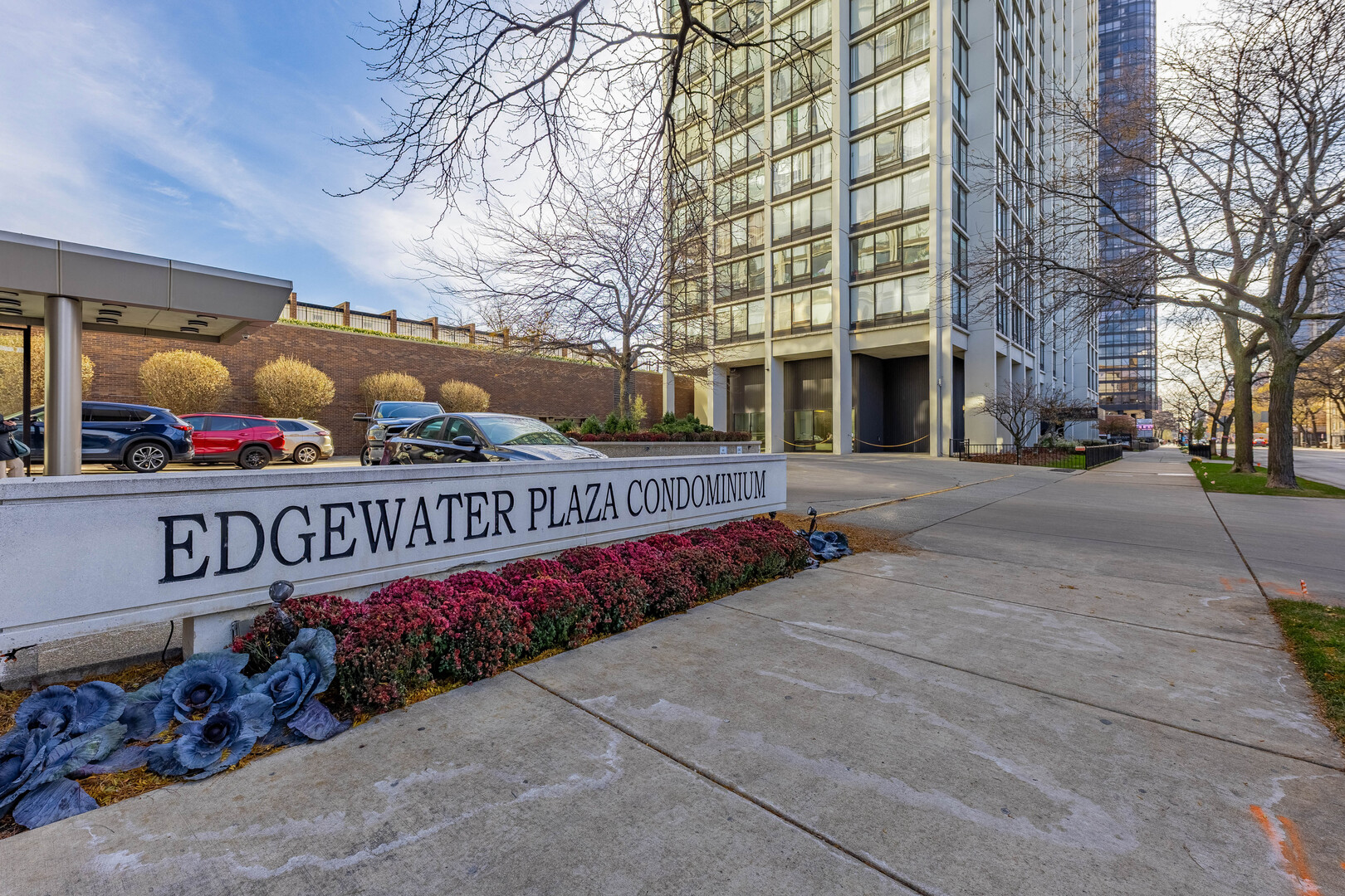 5455 North Sheridan Road, Unit 3906 Chicago, IL 60640 - Photo 2 of 28 a street sign on a sidewalk next to a building