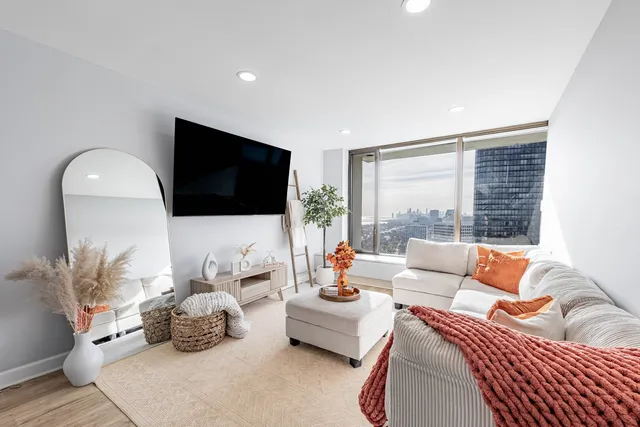 a living room with furniture and a flat screen tv
