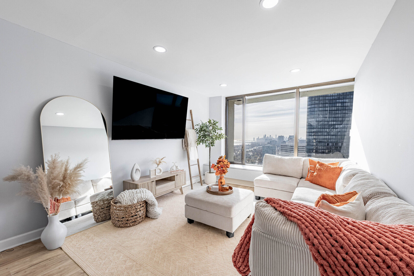 5455 North Sheridan Road, Unit 3906 Chicago, IL 60640 - Photo 8 of 28 a living room with furniture and a flat screen tv
