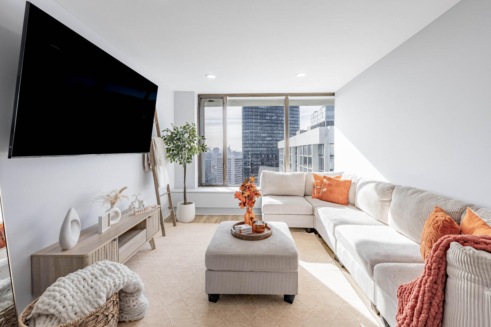 5455 North Sheridan Road, Unit 3906 Chicago, IL 60640 - Photo 9 of 28 a living room with furniture and a flat screen tv