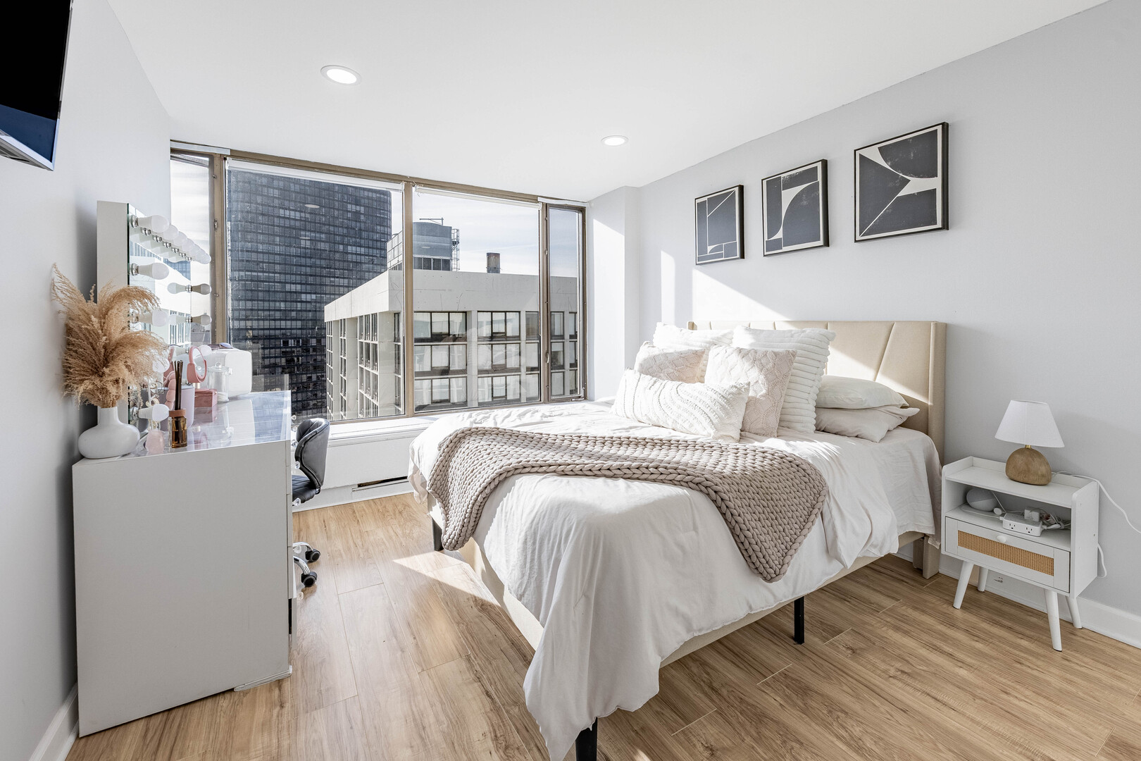 5455 North Sheridan Road, Unit 3906 Chicago, IL 60640 - Photo 10 of 28 a bedroom with a bed and a large window