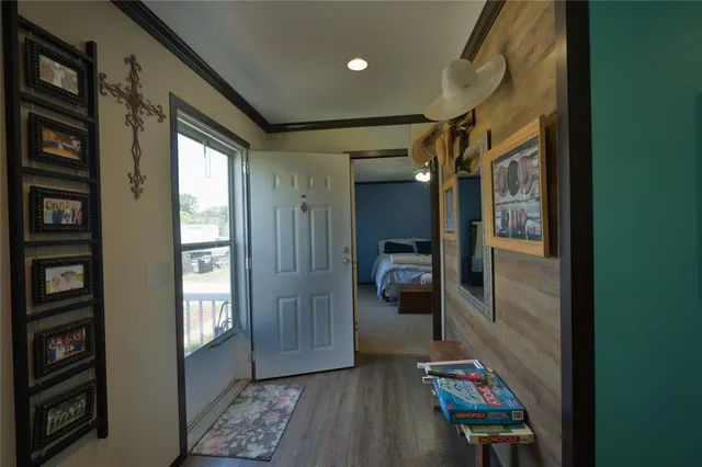 a view of hallway with livingroom and furniture