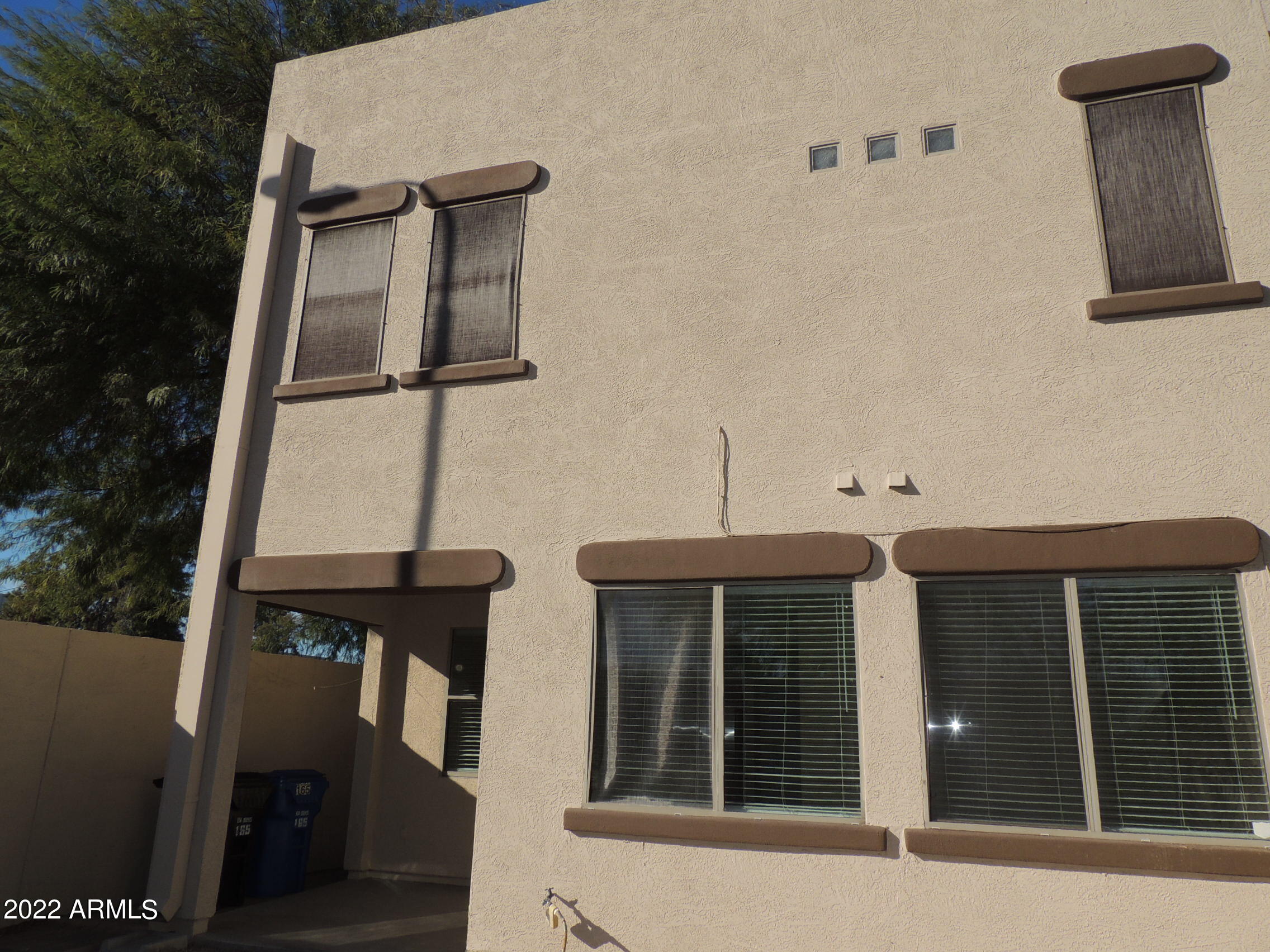 1886 East Don Carlos, Unit 165 Tempe, AZ 85281 - Photo 11 of 34 a front view of a house with parking